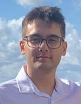A person wearing glasses and a white shirt

Description automatically generated