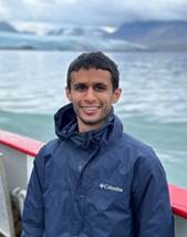 A person standing on a boat

Description automatically generated