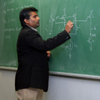 Photo of professor teaching in classroom.