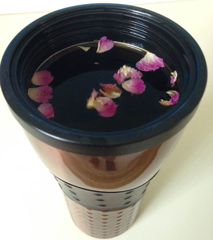Brewed coffee with dried rose buds added for flavor/aroma