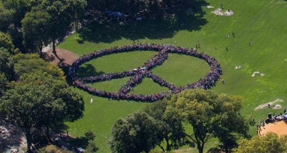 Hundreds of humans form a giant peace sign to honor John Lennon
