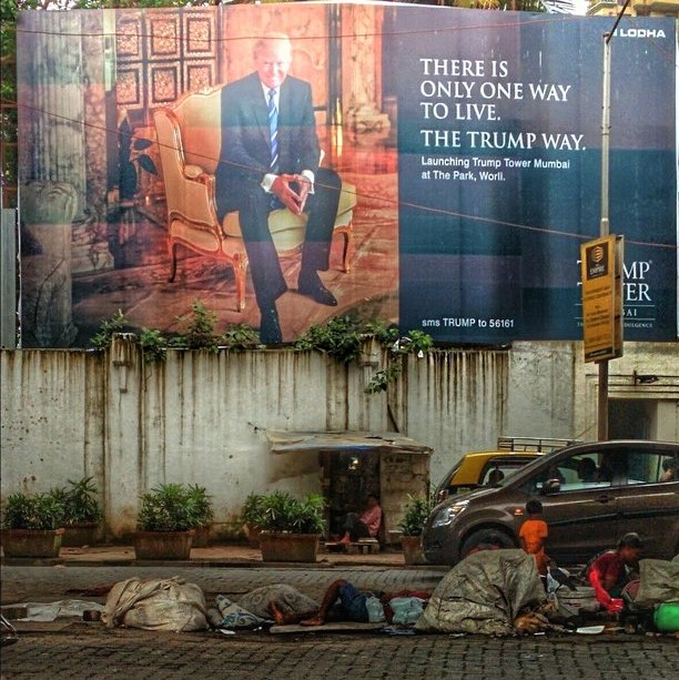 Trump luxury tower ad on a street littered with the homeless