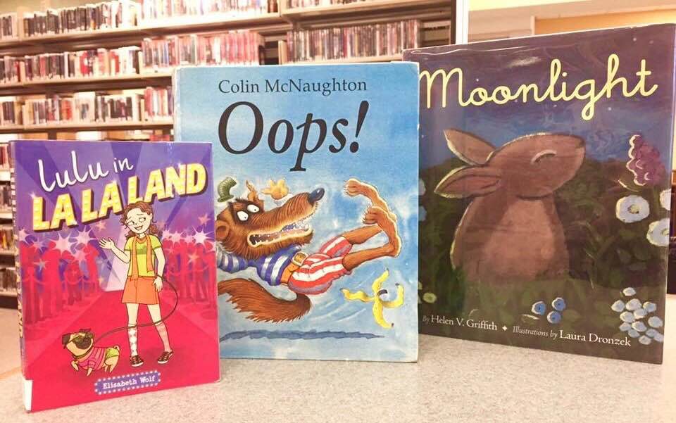 Books arranged in a library to bring to mind Oscar night's last-minute flub