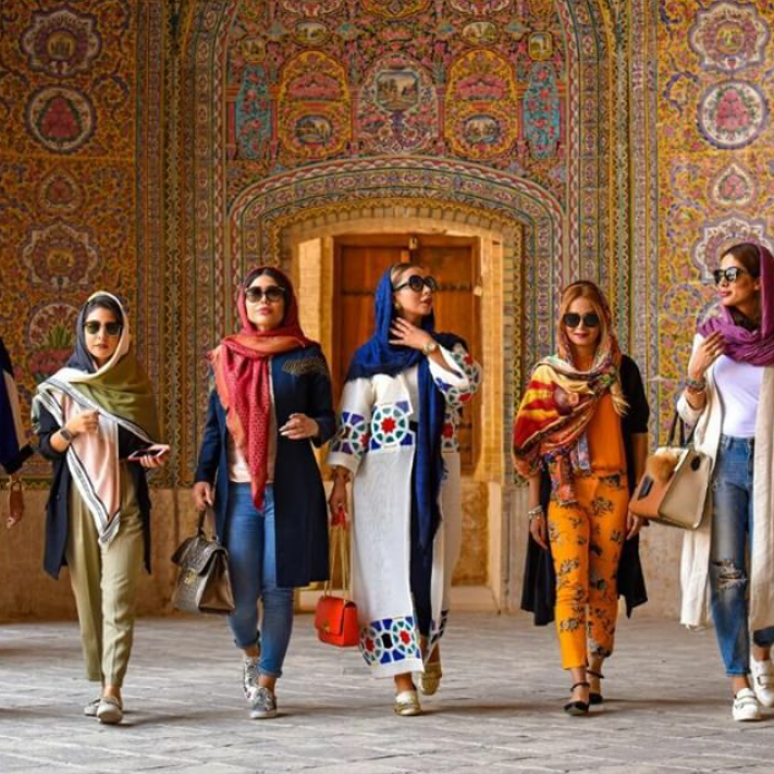 Iranian women walking near a mosque in Shiraz