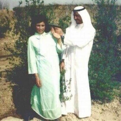 Young Saddam Hussein joking around with a female companion
