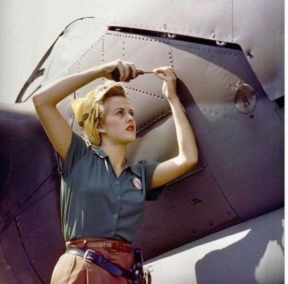 Female Lockheed employee working on a P-38 Lightning in Burbank, CA, 1944