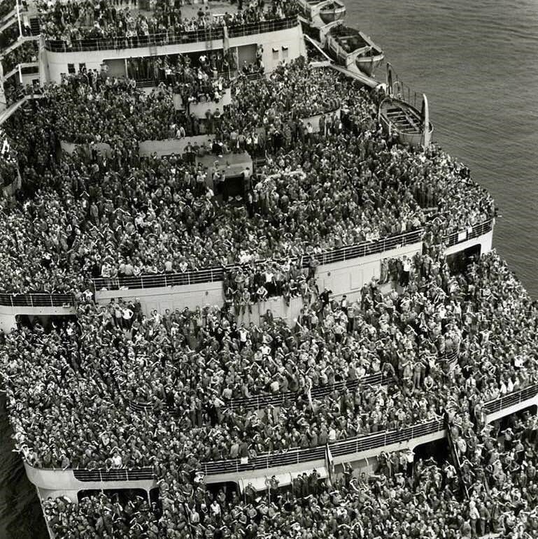 Thousands of returning US troops pulling into NY Harbor in 1945.