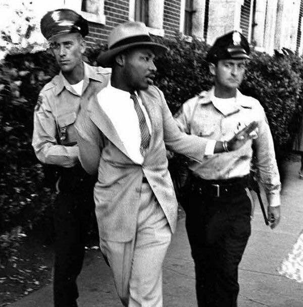 Martin Luther King Jr. being arrested in St. Augustine, Florida, for demanding service at a white-only restaurant, 1964