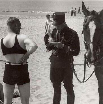 Man being fined for wearing indecent clothes on the beach, Netherlands, 1931
