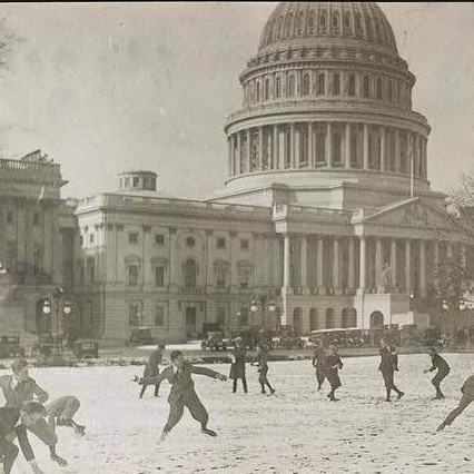 Snowfight between Republican and Democratic page boys in front of the US Capitol building, 1923