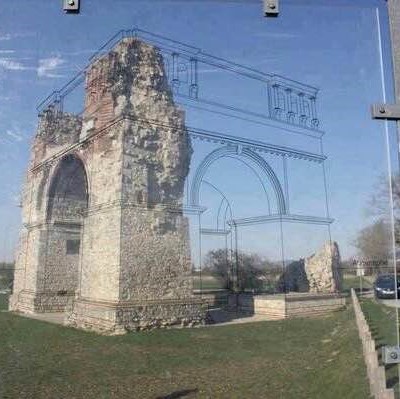 Sketch on a glass panel in front of a ruined edifice helps with visualizing its original form
