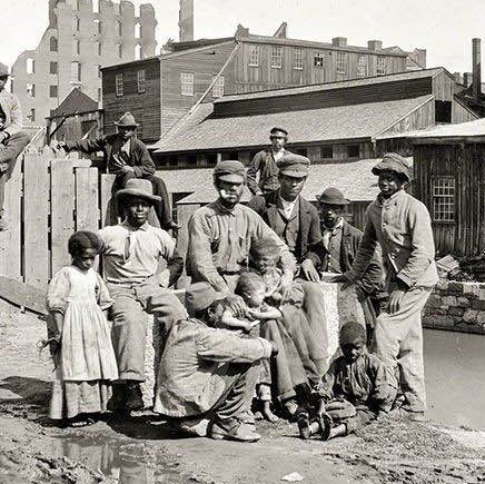 Freed slaves by a canal in Richmond, Virginia, 1865