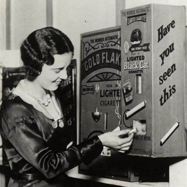 A vending machine that sold already-lit cigarettes for a penny in 1931 England