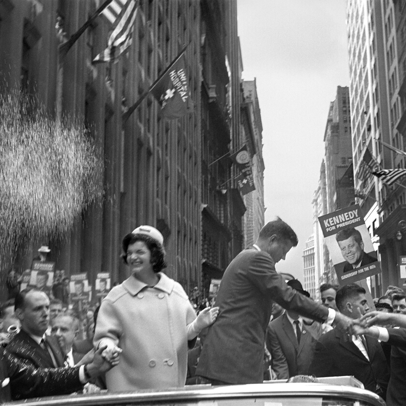 Jacqueline and John F. Kennedy on an NYC street, 1960; photograph by Cornell Capa
