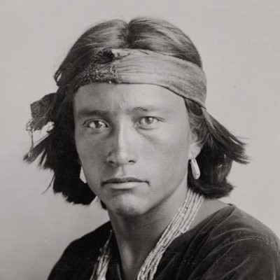 Navajo young man, photographed by Carl E. Moon, 1906