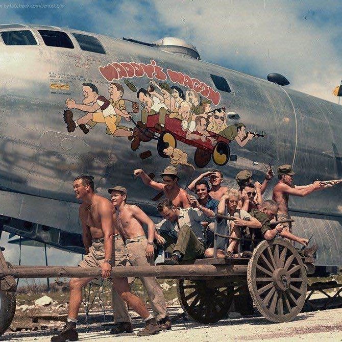 Colorized photo of Captain Walter Young and his crew in front of their caricatures on their B-29 Superfortress, 1944