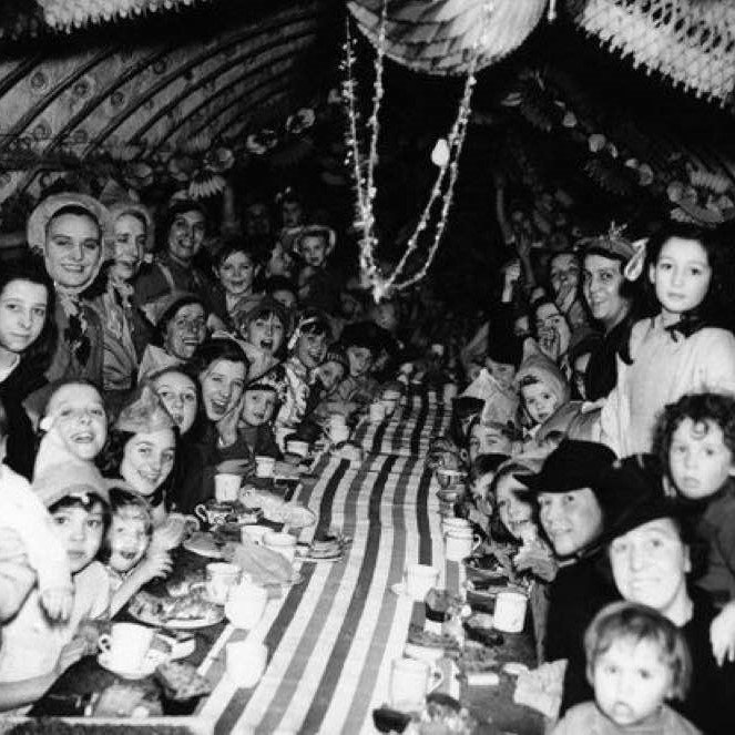 Londoners celebrate Christmas Day 1940 in an underground bomb shelter
