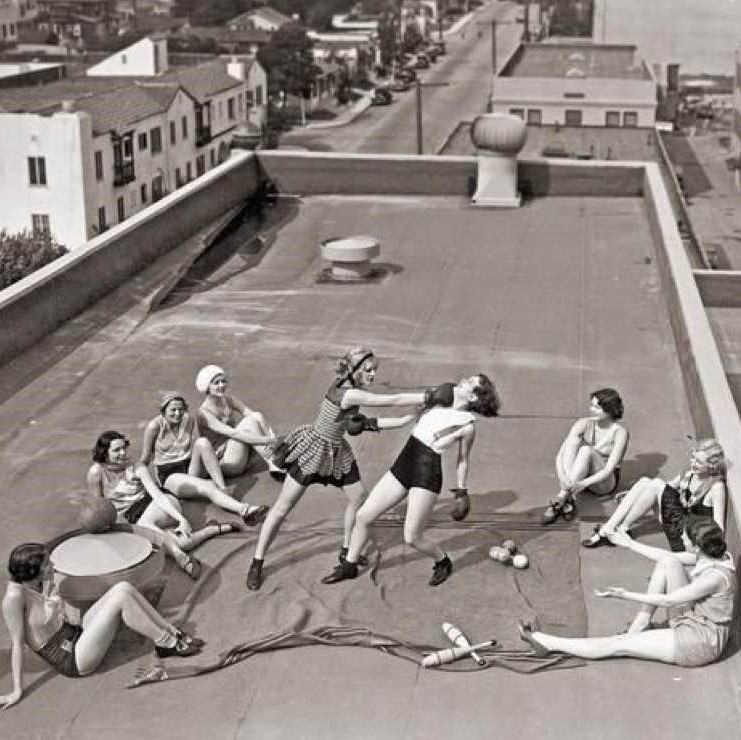 Women boxing on a roof, 1930s
