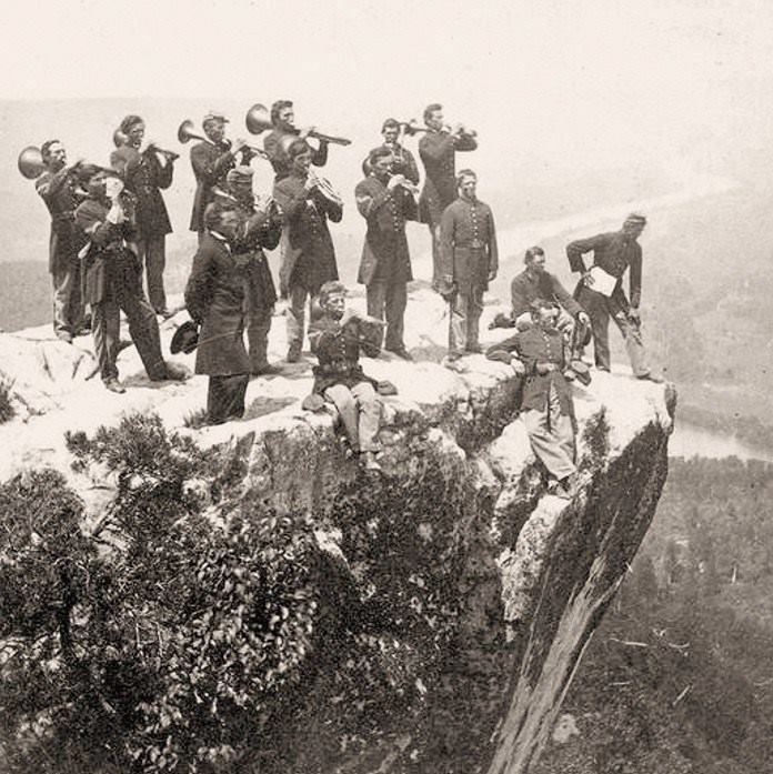 Union Army brass band playing atop Lookout Mountain, with the Tennessee River in the background, 1864