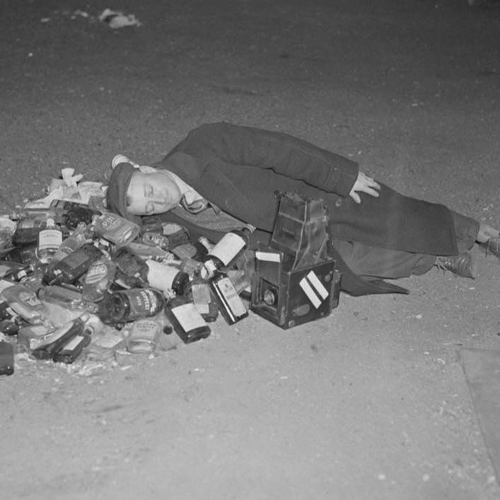 Drunk man rests after a night of celebrating the end of Prohibition, 1933