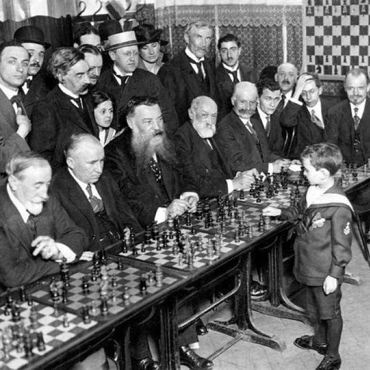 Eight-year-old Samuel Reshevsky defeating several chess masters at once in France, 1920