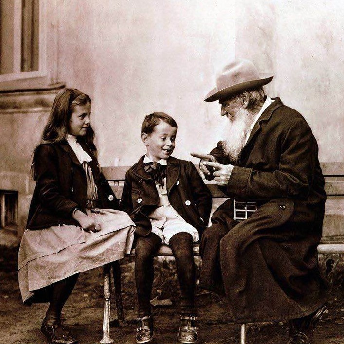 Russian writer, philosopher, and mystic Leo Tolstoy telling his grandchildren a story, circa 1890