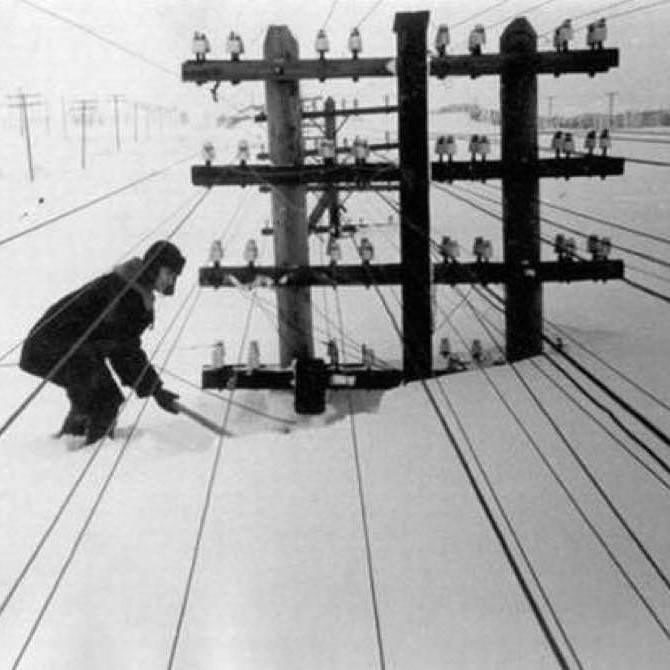 High-voltage power lines almost buried in snow, Siberia, 1960