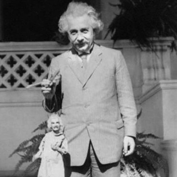 Albert Einstein holding an Albert Einstein puppet, 1931