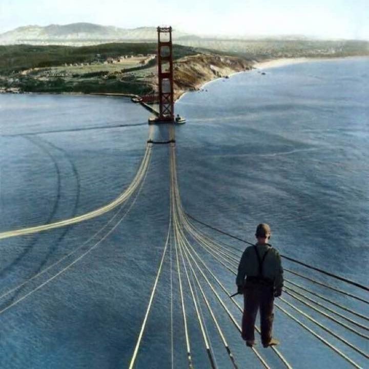 A fearless worker standing on the unfinished Golden Gate Bridge, 1935