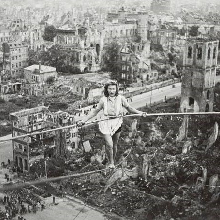 High-wire artist performs above the ruins of Heumarkt in Cologne, Germany, 1946