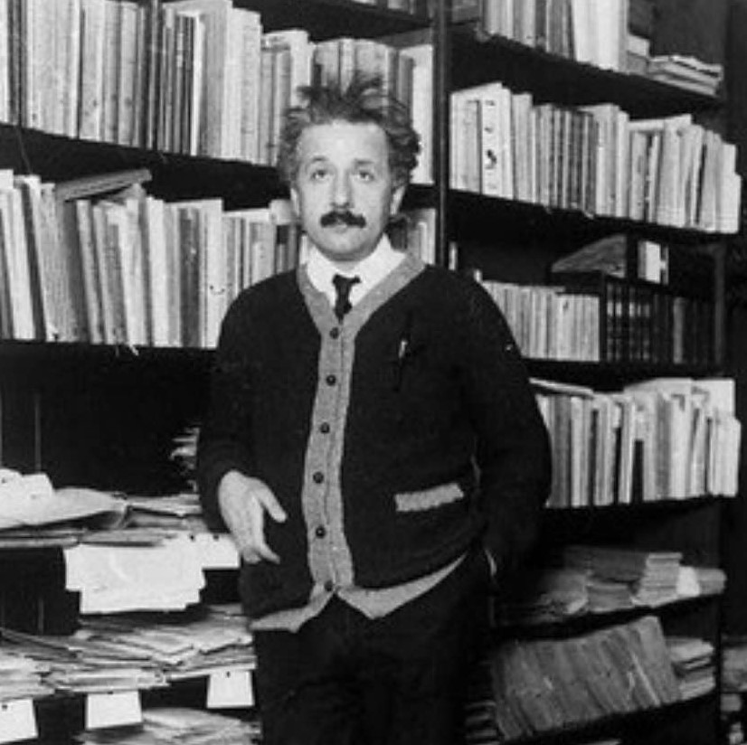 Albert Einstein in front of bookcase, undated photo