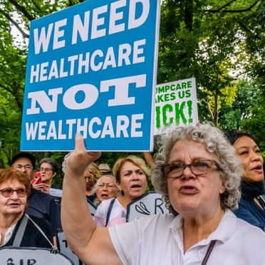 Interesting protest sign: 'We need healthcare, not wealthcare'