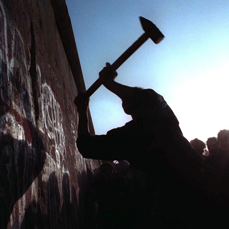 Berlin wall being knocked down