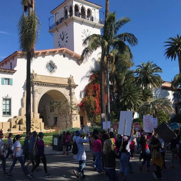 Women's March Santa Barbara participants pass in front of the SB Courthouse on Anacapa Street