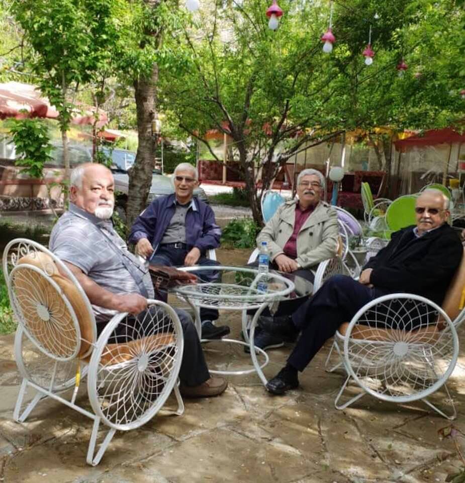 Old-time college friends, photographed in a restaurant on their last day of touring Kurdistan