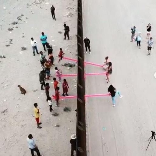 Architect Ronald Rael installs seesaws along the US-Mexico border wall for children on the two sides to play together