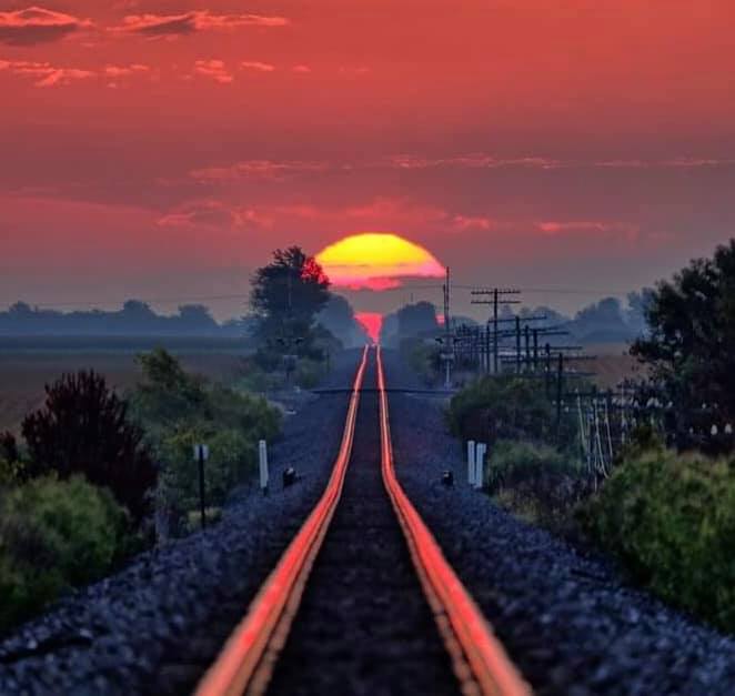 Sunset reflected on railroad tracks