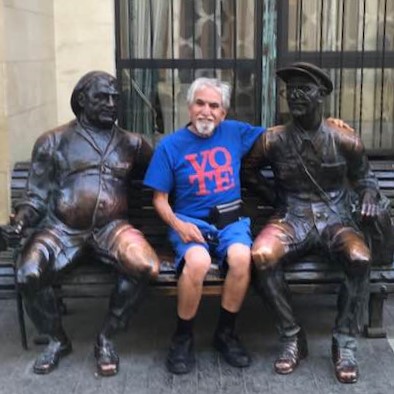 My photo with a couple of statues sitting on a bench in Tbilisi