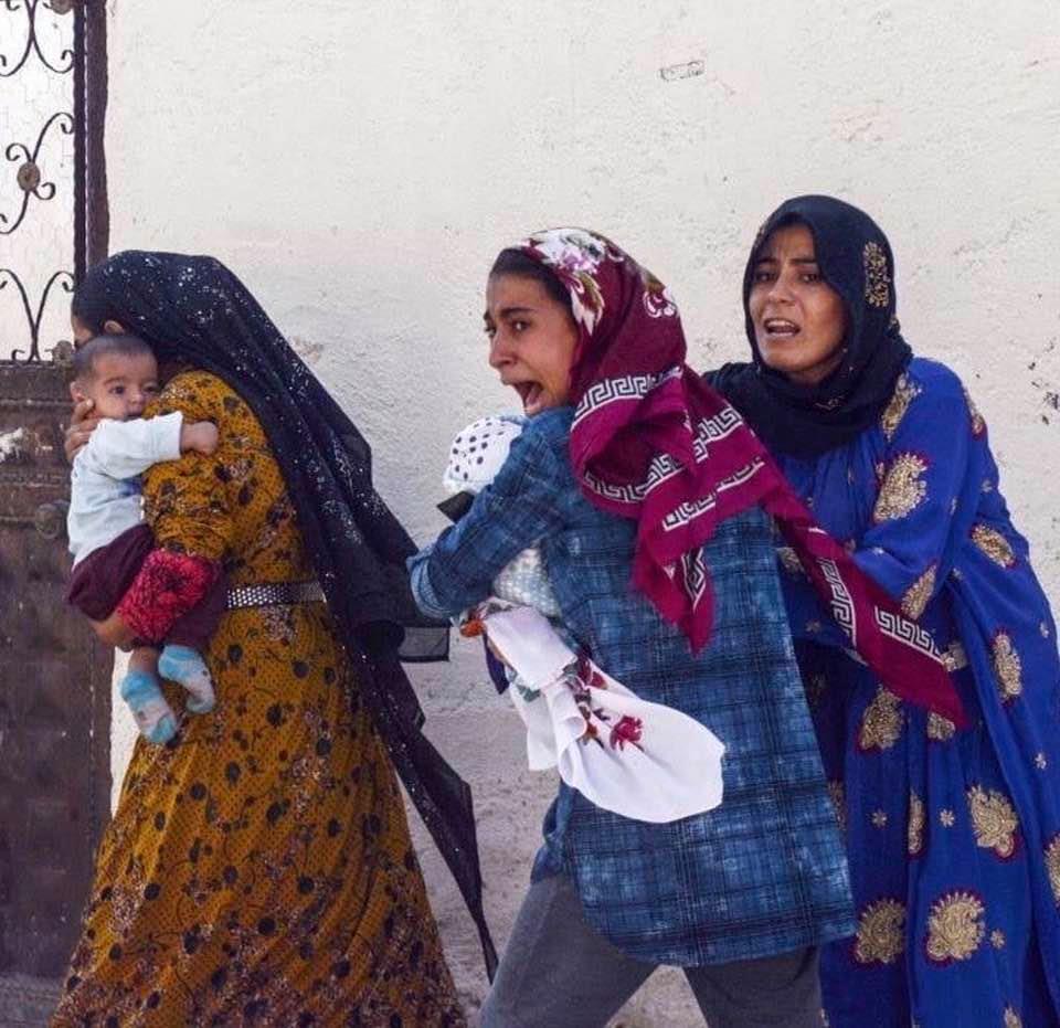 Kurdish women fleeing a Turkish air raid