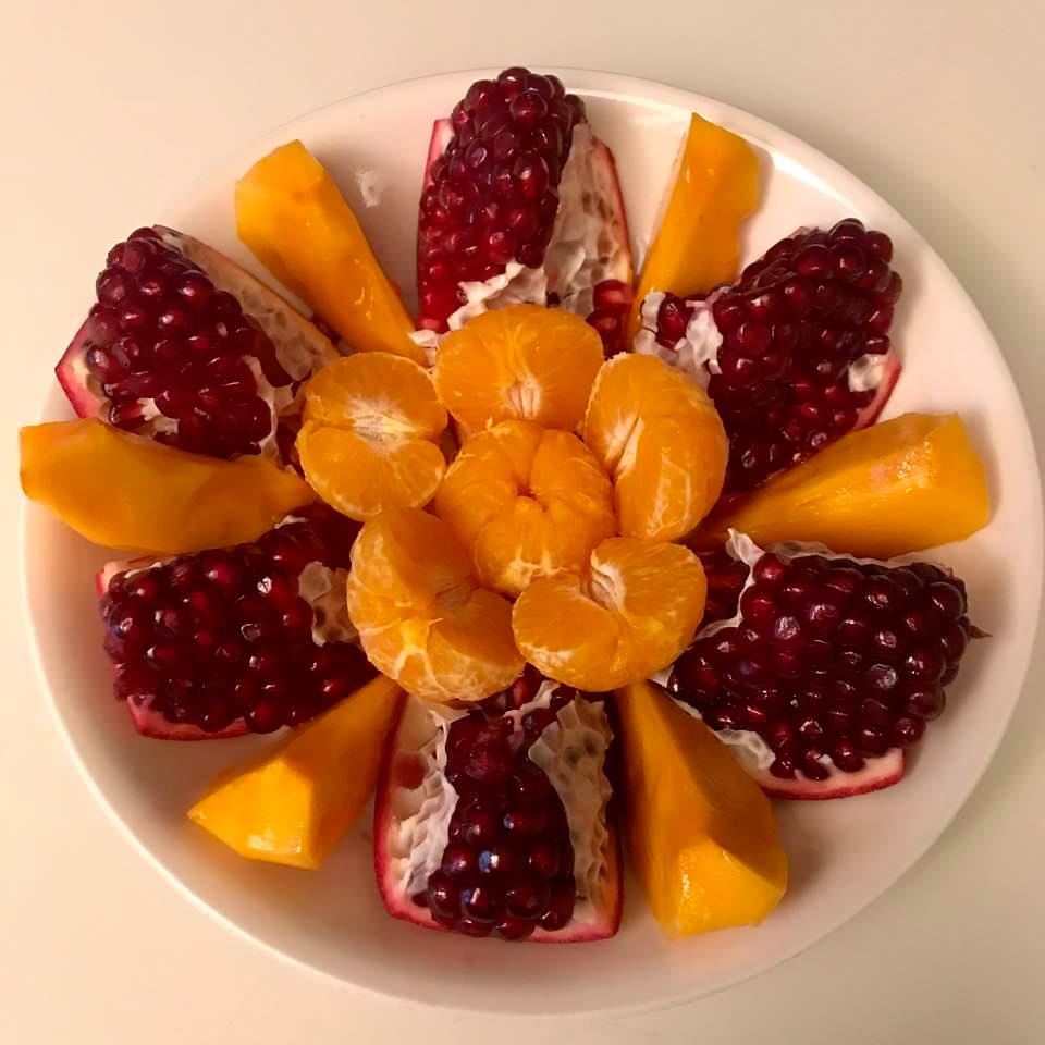 Heavenly fruit plate: Pomegranates, persimmons, tangerines
