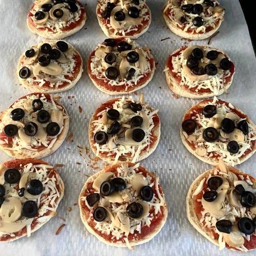 English-muffin pizzas, with mushroom and black-olive toppings