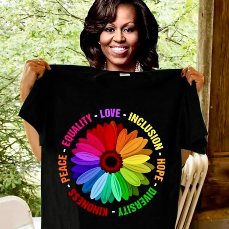 Michelle Obama, with T-shirt celebrating peace, equality, love, inclusion, hope, diversity, and kindness