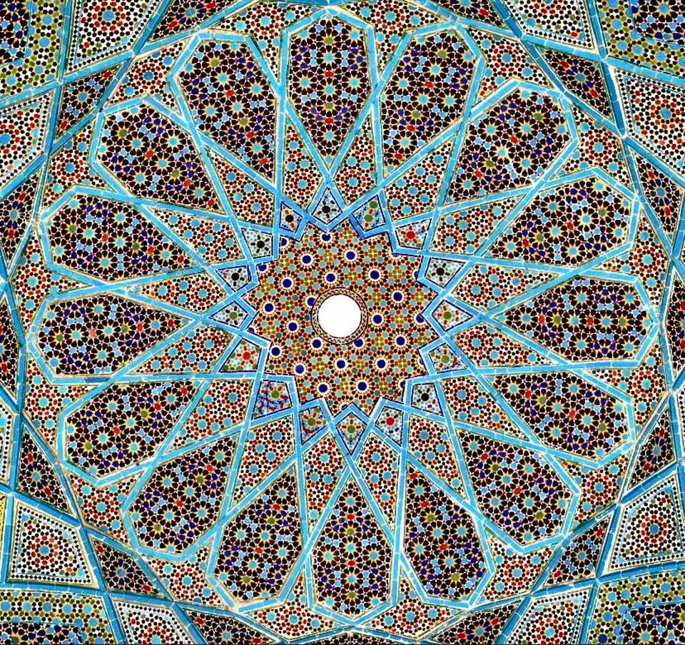 The exquisite symmetry and colors of the ceiling in Hafez's tomb, Shiraz, Iran