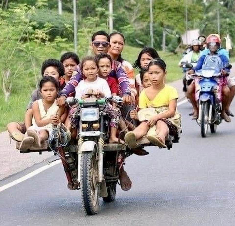 Family of 10 riding a motorbike
