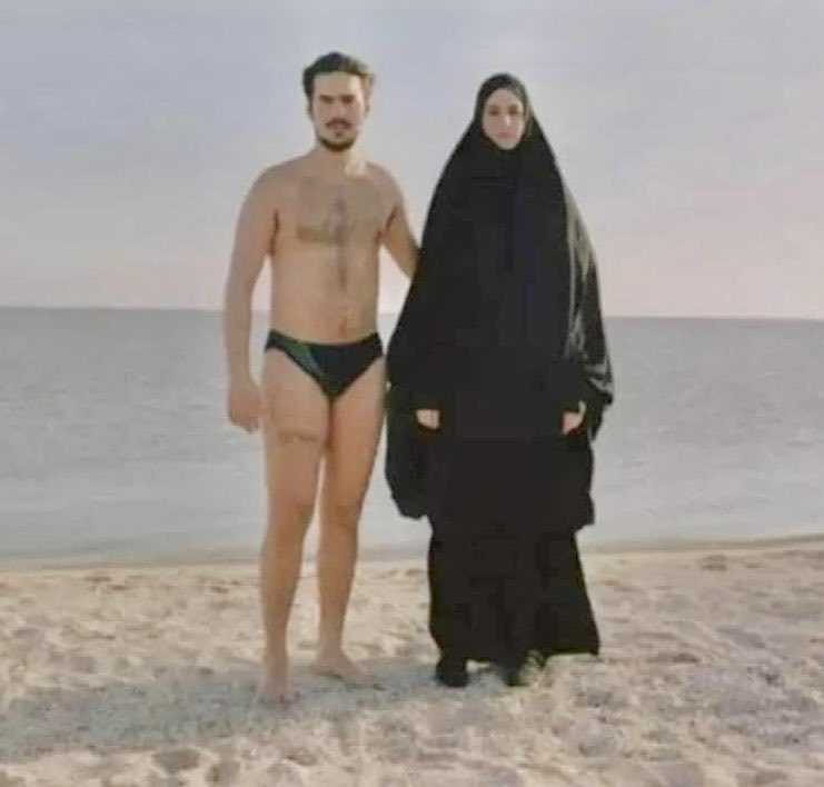 Gender equity, Islamic style: Man wearing a brief bathing suit, woman covered from head to toe