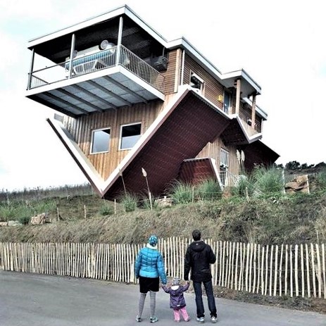 Believe it or not: This house was not toppled by a storm; it was built upside-down!