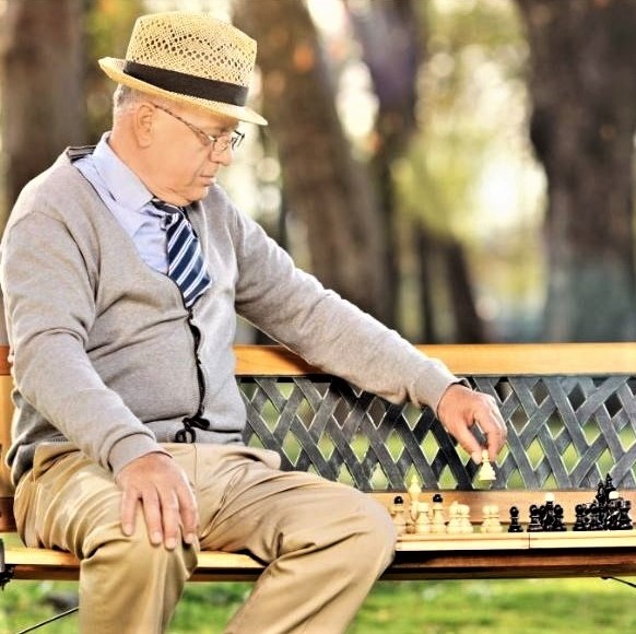 The loneliness epidemic: Man playing chess with himself