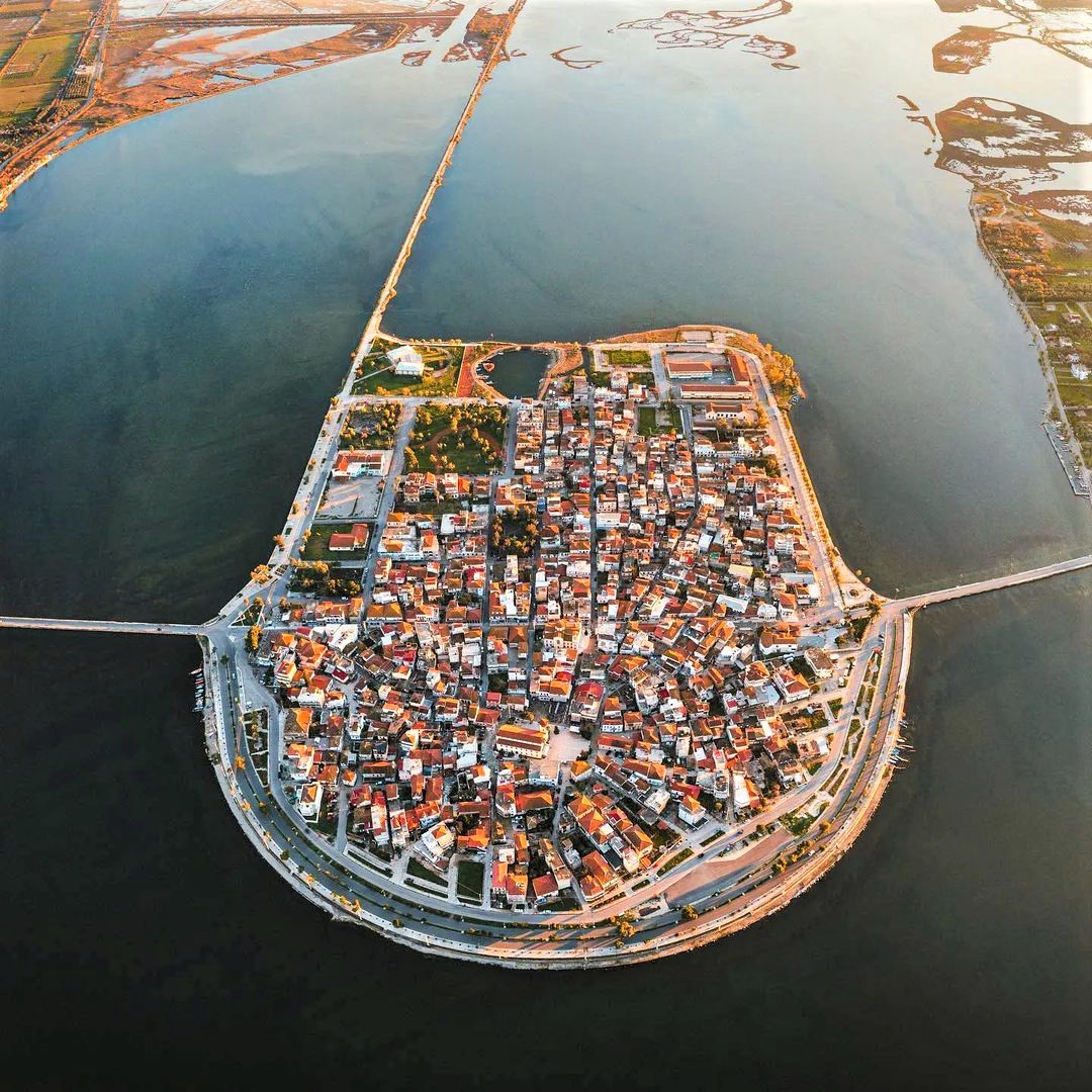 A lagoon island in Greece: Aitoliko is a small, densely-populated island which is connected to the mainland by two 19th-century stone-arch bridges