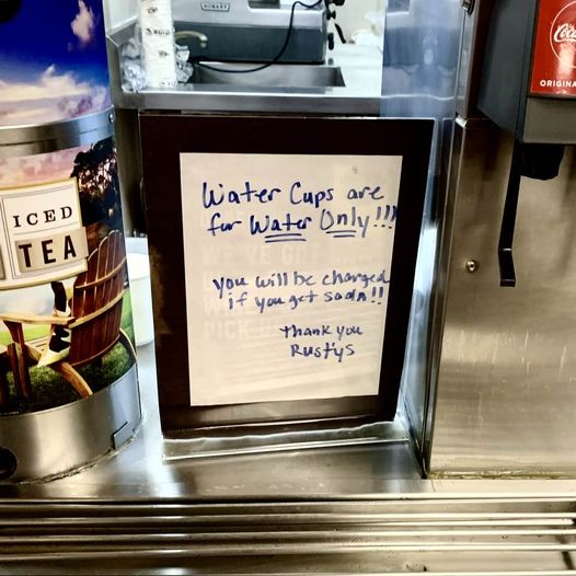 Reminder posted at Rusty's Pizza on Storke Road in Goleta: Water cups are for water only