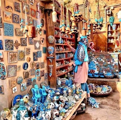 Pottery shop in Yazd, Iran, prominently displaying the distinct color of Iranian ceramics, turquoise blue